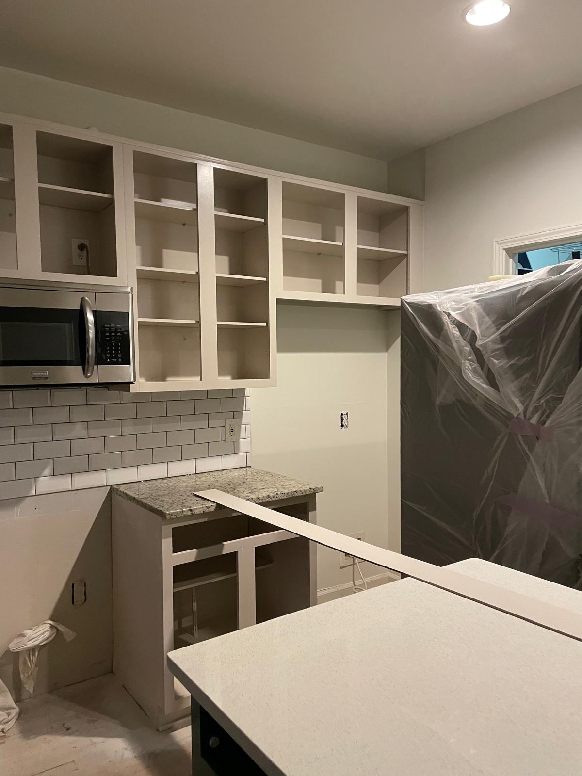 Custom open shelving and cabinet build-out in a kitchen in Metro Atlanta, GA
