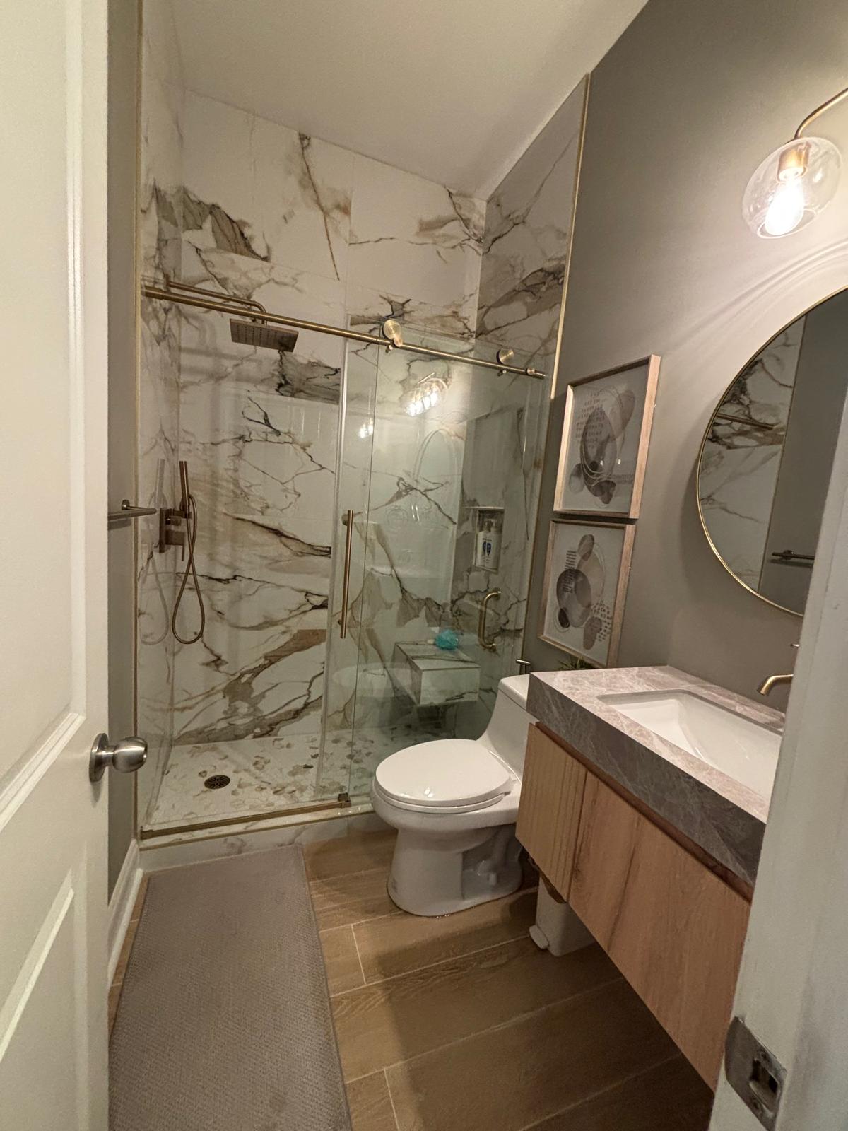 Wood-look plank tile flooring in a remodeled bathroom in Metro Atlanta, GA
