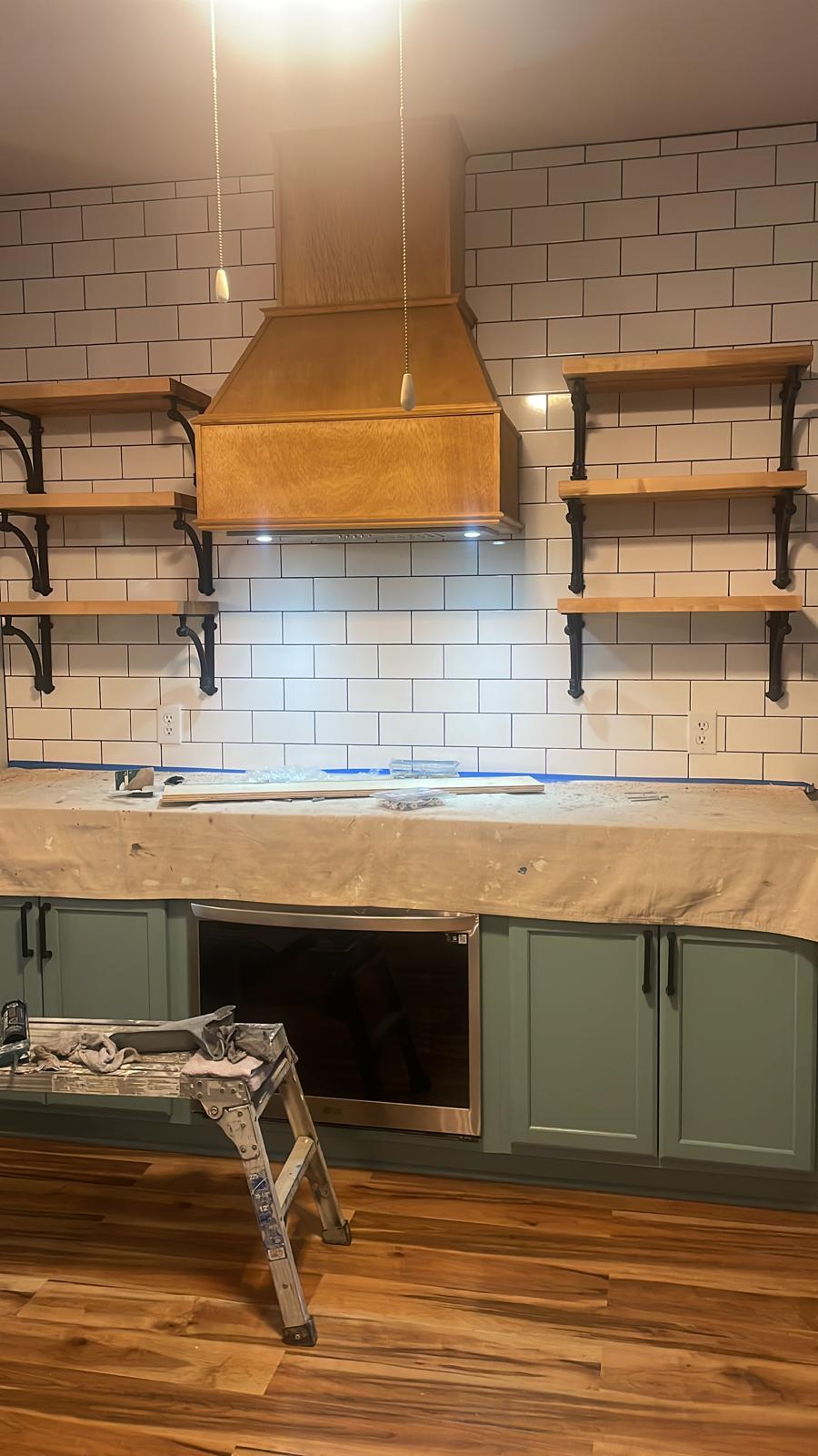 Custom wood range hood and open shelving on a tiled accent wall in Metro Atlanta, GA
