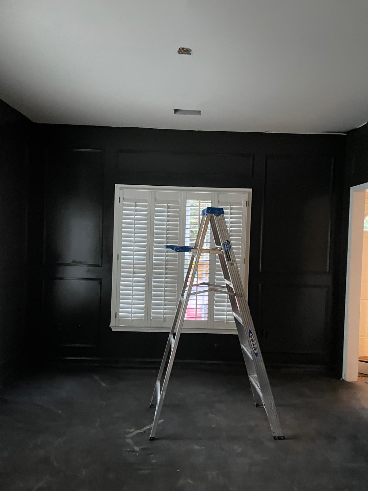 Dining room walls and paneling sprayed in a deep black finish in Metro Atlanta, GA